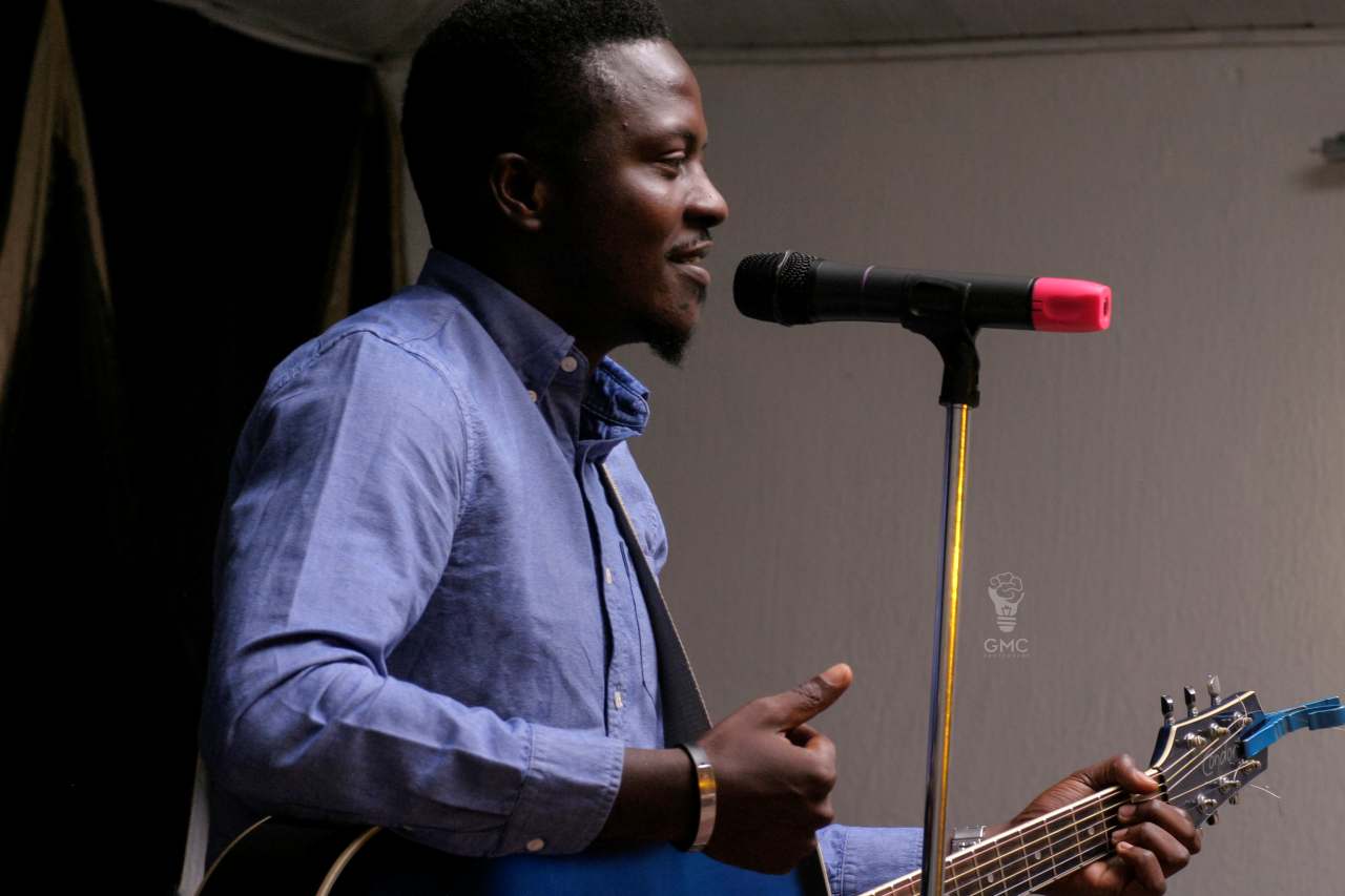 A young musician performing on stage